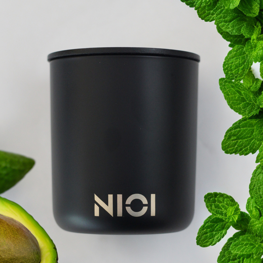 Avocado and mint large hand poured candle by Nioi 63 Hour burn time Black Vessel Gold logo