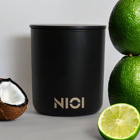Coconut and lime large candle by Nioi 63 Hour burn time Black Vessel Gold logo