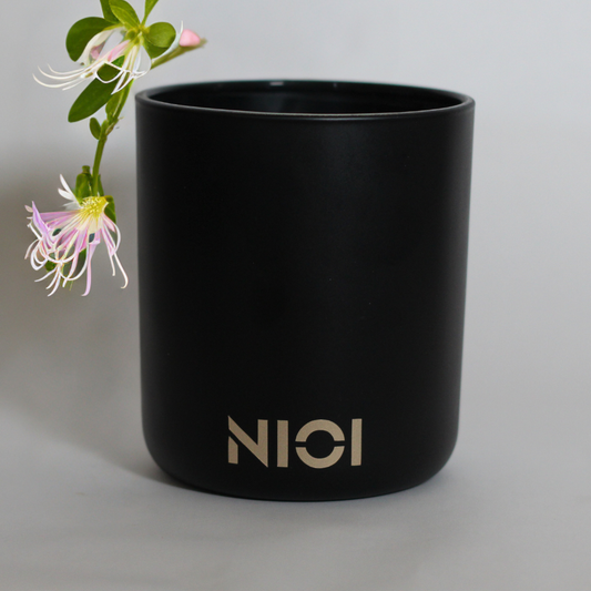 Japanese Honeysuckle large candle by Nioi 63 Hour burn time Black Vessel Gold logo